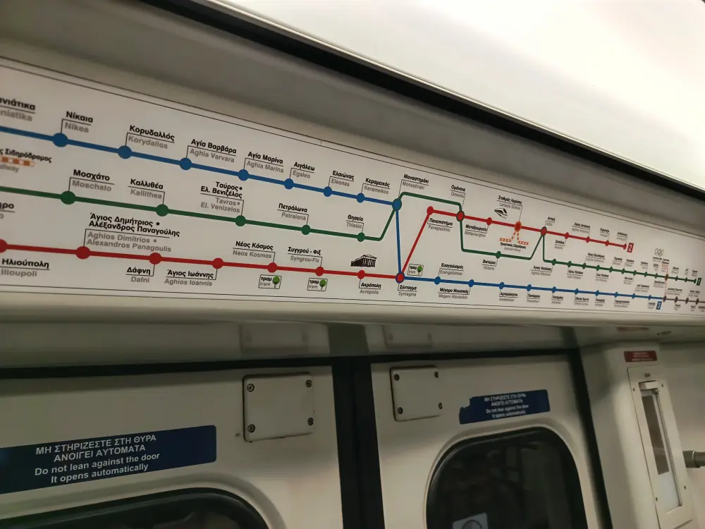 In the Athens metro trains, there is a metro map above the doors.
