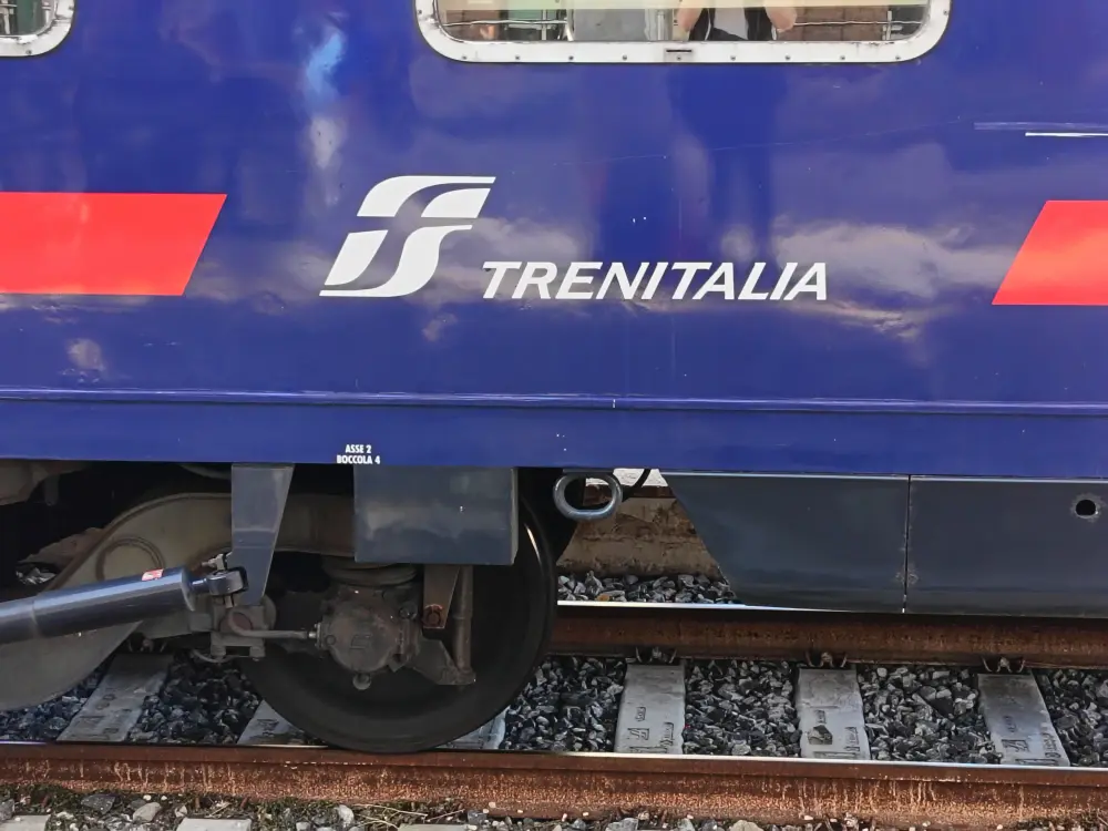Trenitalia logo on the side of a train carriage