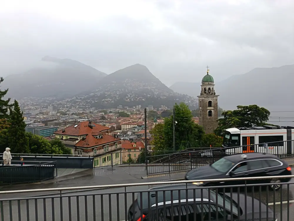 The city of Lugano. A mountain is visible in the background.