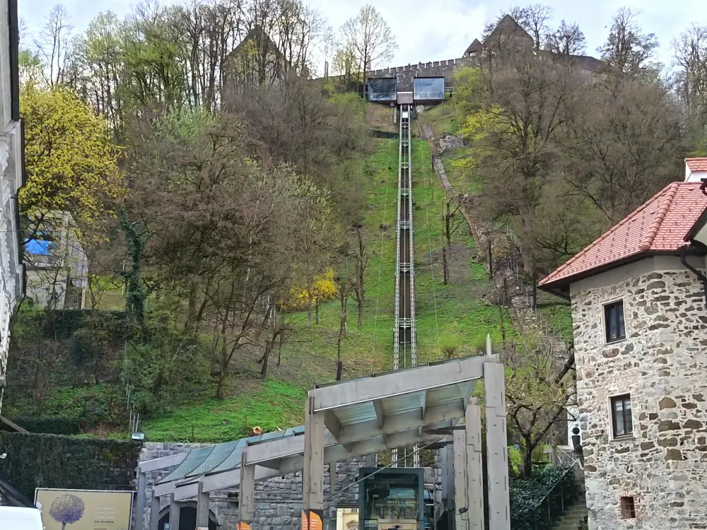 A castle on a high hill. An elevator takes people there.