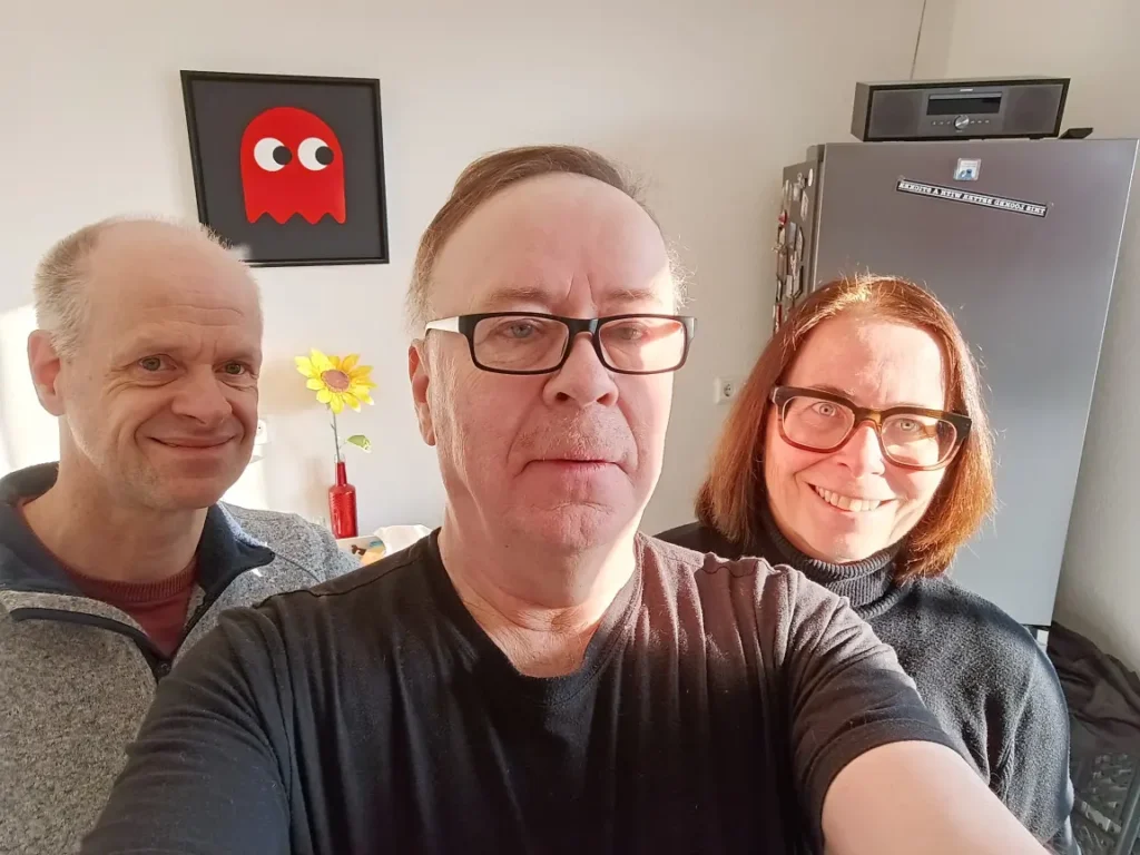 Two men and one woman.