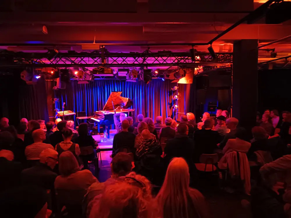 The audience is waiting for the jazz concert to begin.